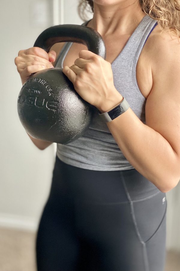 Close-up of Coach Kristin holding a kettle bell